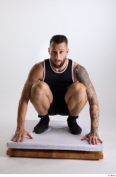 Whole Body Man White Sports Shorts Slim Athletic Kneeling Top Studio photo references